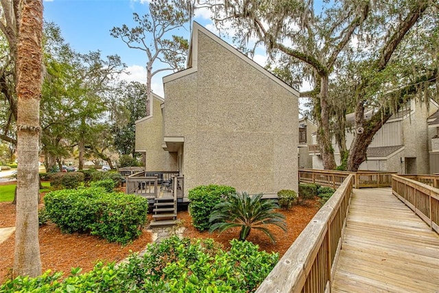 view of side of home with a deck