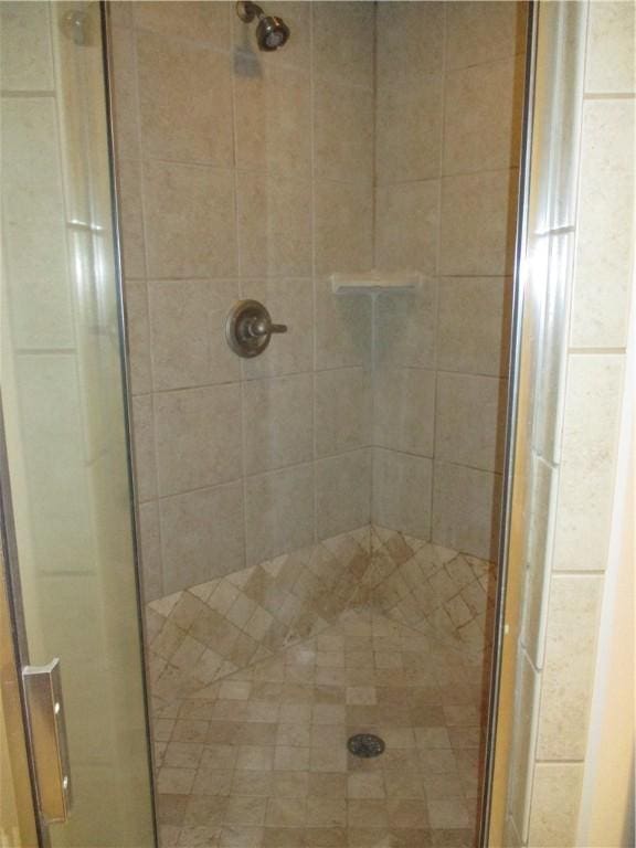 bathroom featuring an enclosed shower