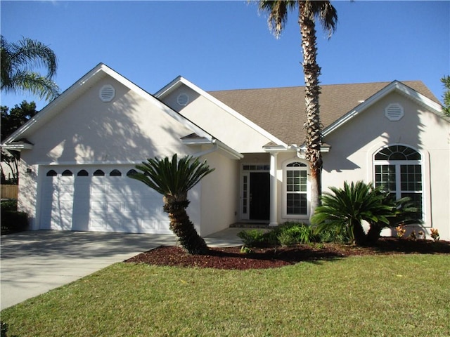 view of front facade featuring a front yard and a garage