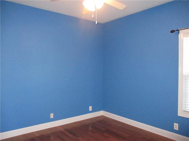 spare room featuring hardwood / wood-style flooring and ceiling fan