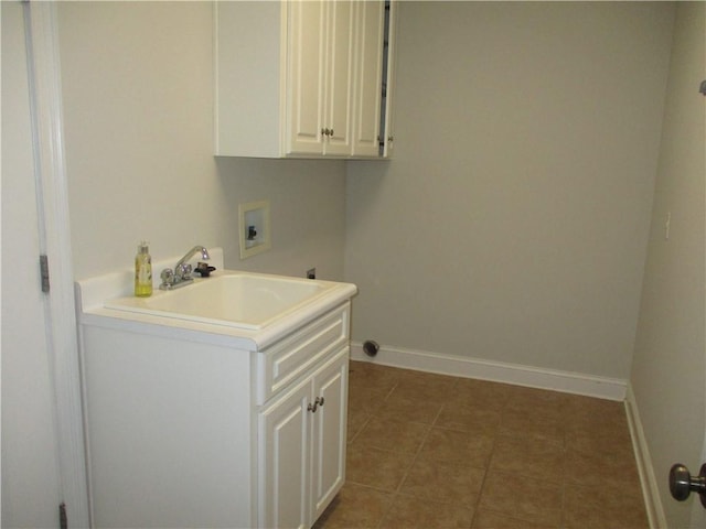 laundry room featuring electric dryer hookup, cabinets, tile patterned floors, sink, and washer hookup