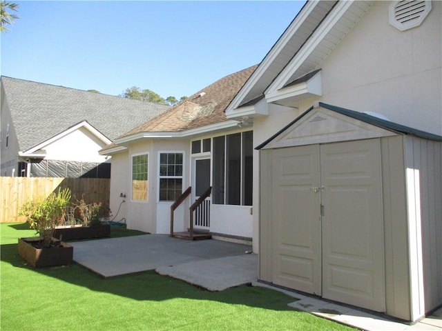 exterior space featuring a yard and a patio area