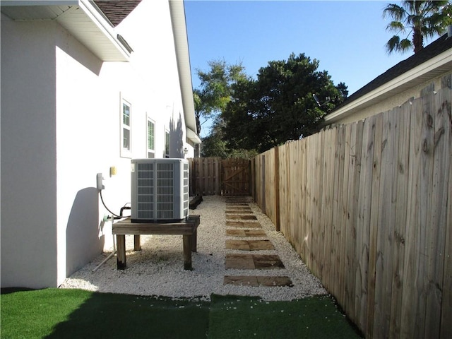 view of yard featuring central air condition unit