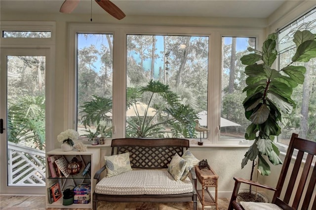 sunroom / solarium with ceiling fan and a wealth of natural light