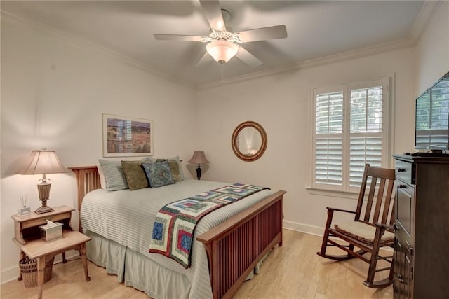 bedroom with ceiling fan, crown molding, and light hardwood / wood-style flooring