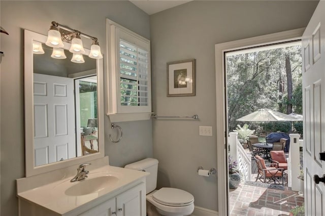 bathroom featuring vanity and toilet