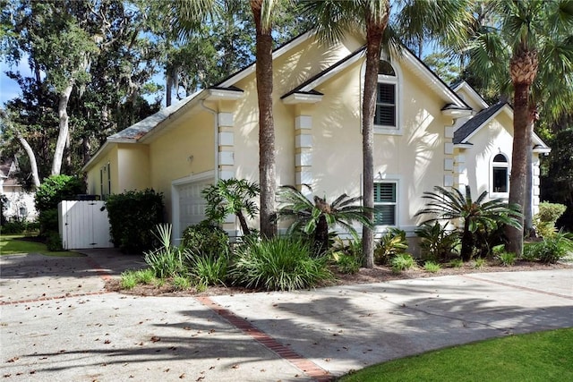 view of side of home with a garage