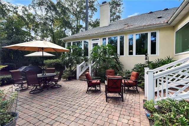 view of patio featuring a grill