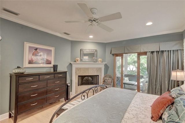 bedroom with a fireplace, access to outside, ceiling fan, and ornamental molding