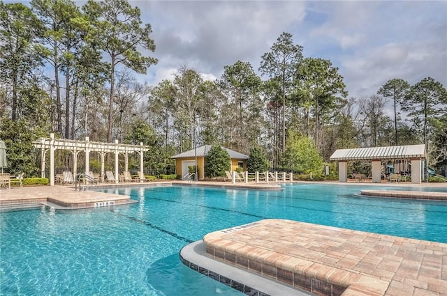pool featuring a patio and a pergola