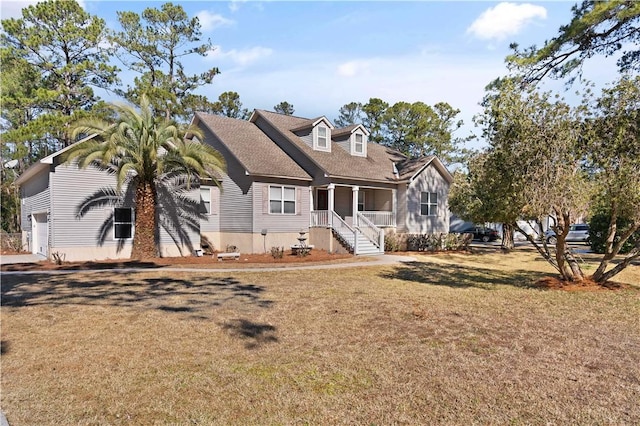 cape cod-style house featuring a porch and a front yard