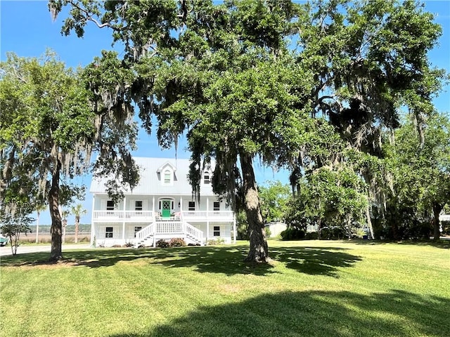 221 River Ridge Rd, Brunswick, GA 31523 - view of front facade featuring stairway, covered porch, and a front lawn