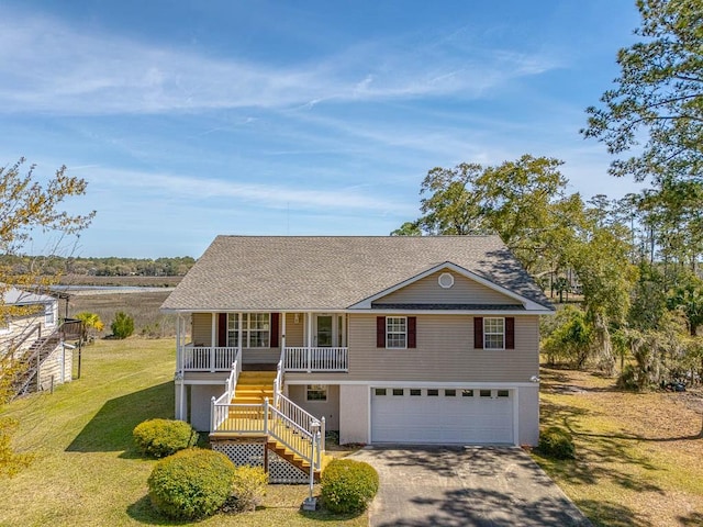 1056 Fiddler Trce, Townsend, GA 31331 - view of front of property with covered porch, stairs, a garage, a front yard, and concrete driveway