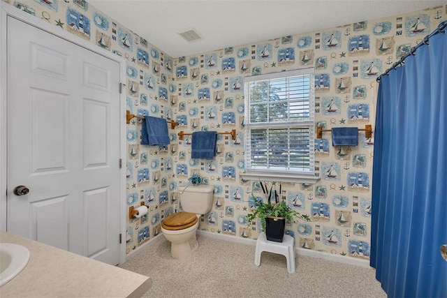 1056 Fiddler Trce, Townsend, GA 31331 - bathroom featuring wallpapered walls and vanity