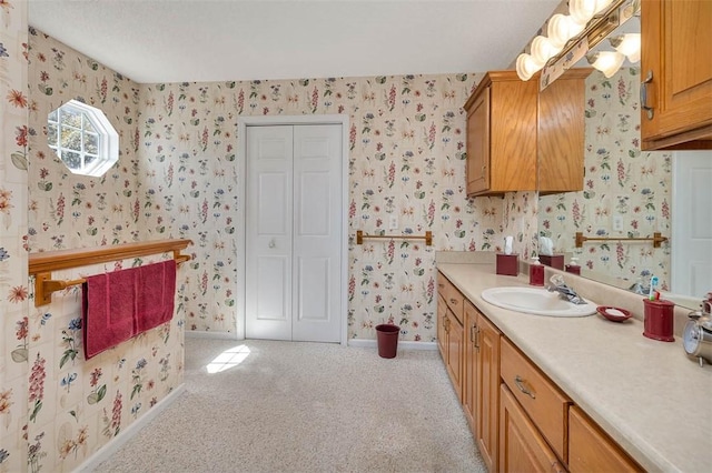1056 Fiddler Trce, Townsend, GA 31331 - bathroom with wallpapered walls, vanity, and carpet