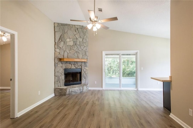 104 Bamboo Dr, Kingsland, GA 31548 - unfurnished living room with ceiling fan, a fireplace, wood finished floors, and high vaulted ceiling