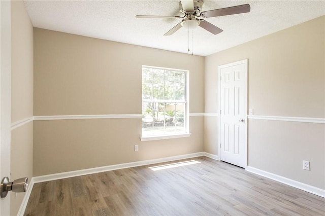 104 Bamboo Dr, Kingsland, GA 31548 - unfurnished room with wood finished floors, a ceiling fan, and a textured ceiling