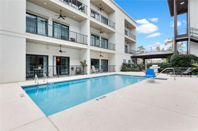 view of swimming pool featuring a gazebo, a patio, and grilling area