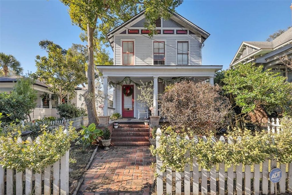 victorian-style house featuring a porch