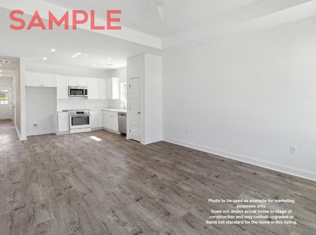 unfurnished living room featuring wood-type flooring