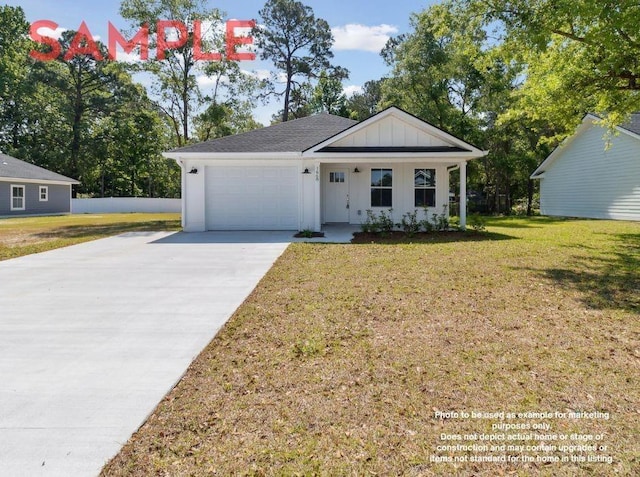 view of front of property featuring a garage and a front yard