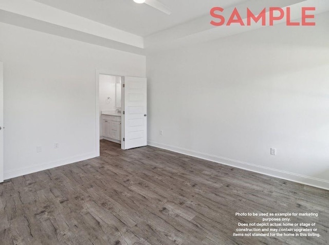 spare room with dark wood-type flooring