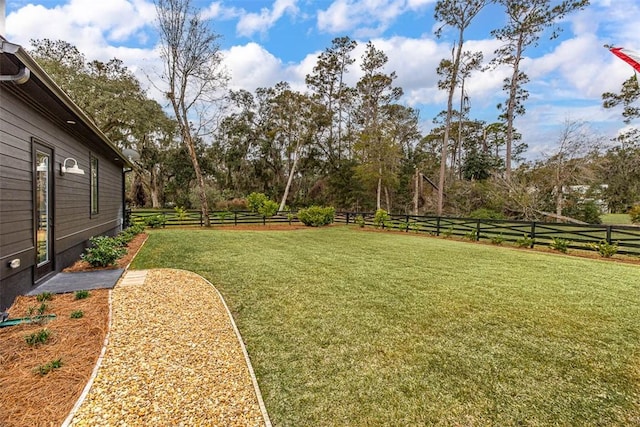 view of yard with a rural view