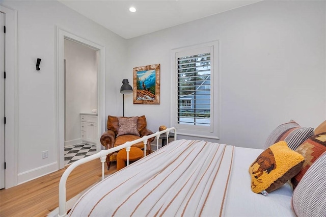 bedroom featuring light hardwood / wood-style flooring and ceiling fan