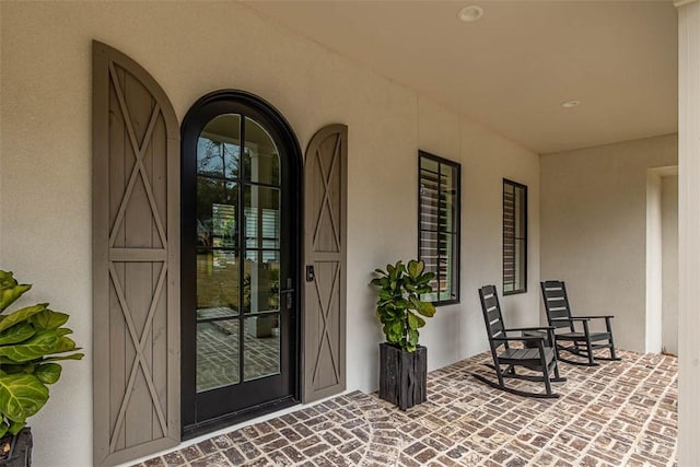 dining room with light wood-type flooring and french doors