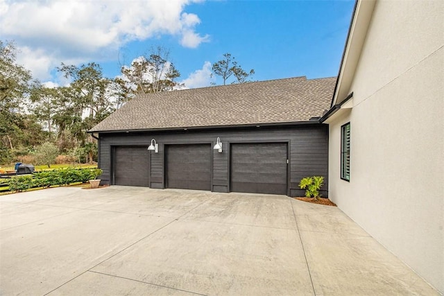 view of front of property with a garage and a front lawn