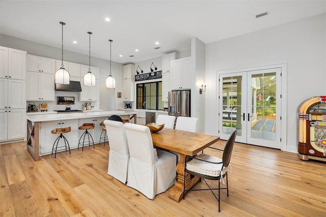 interior details with hardwood / wood-style flooring and wine cooler