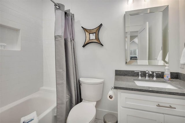 full bathroom with vanity, toilet, and shower / bath combo with shower curtain