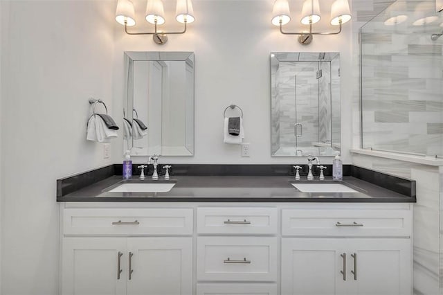 bathroom featuring vanity and an enclosed shower