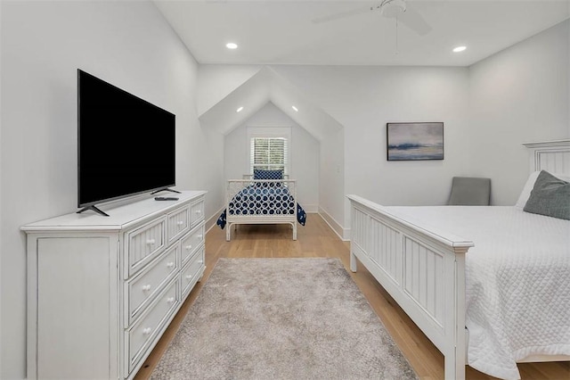 bedroom with light hardwood / wood-style flooring and ceiling fan