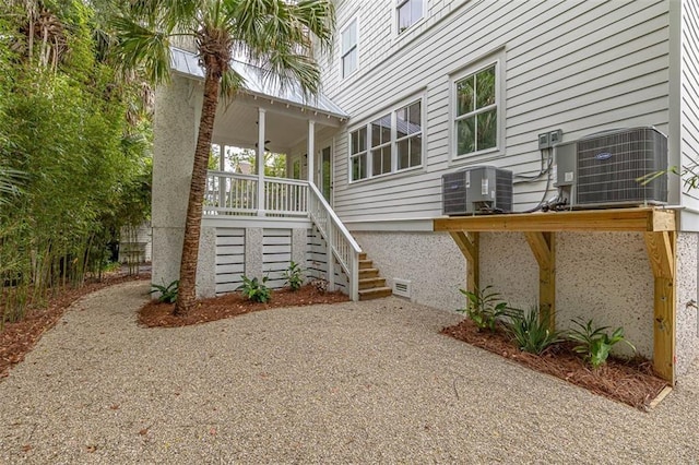 exterior space featuring cooling unit and covered porch