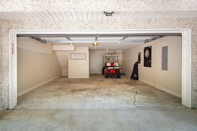 200 Salt Air Dr Unit 139, Saint Simons Island, GA 31522 - garage with electric panel and a garage door opener