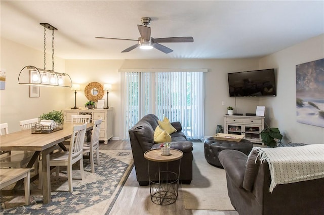 200 Salt Air Dr Unit 139, Saint Simons Island, GA 31522 - living area with a ceiling fan and light wood-style floors