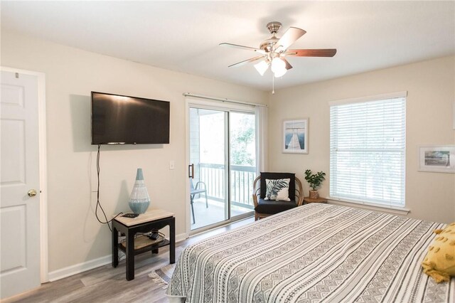200 Salt Air Dr Unit 139, Saint Simons Island, GA 31522 - bedroom featuring access to outside, light wood-style floors, baseboards, and a ceiling fan