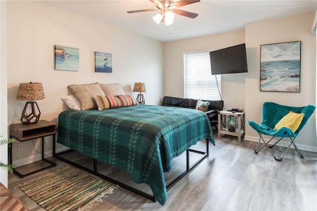 200 Salt Air Dr Unit 139, Saint Simons Island, GA 31522 - bedroom with wood finished floors, baseboards, and a ceiling fan