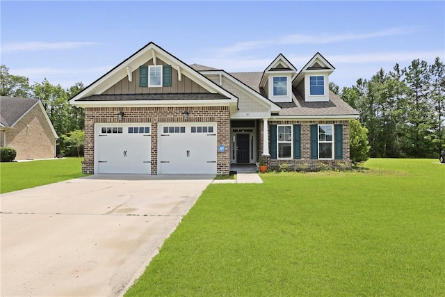64 Wellington Cir, Brunswick, GA 31525 - craftsman-style home with brick siding, a front yard, driveway, an attached garage, and board and batten siding
