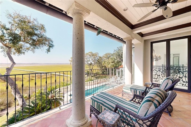 view of patio with a fenced in pool, a balcony, french doors, and ceiling fan