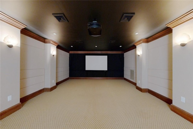 home theater with light carpet and crown molding