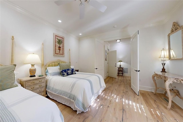 bedroom featuring crown molding, ceiling fan, and light wood-type flooring