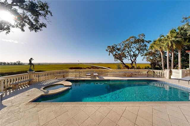 view of swimming pool featuring a patio area