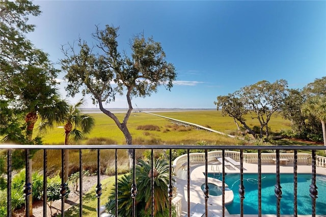 balcony featuring a rural view