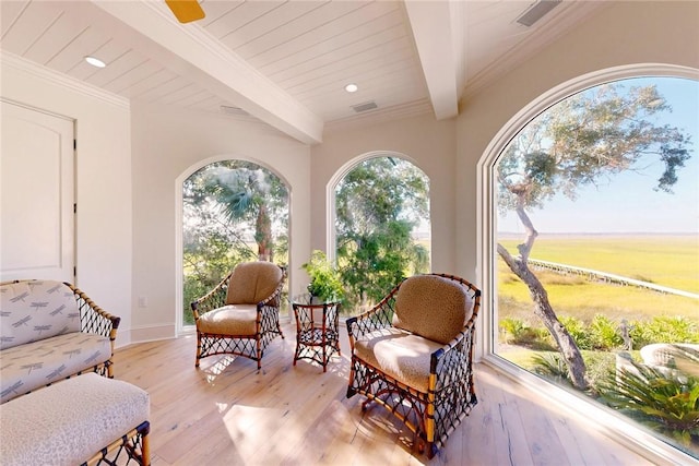 sunroom featuring wood ceiling and beam ceiling