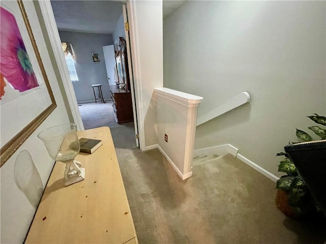 622 Brockinton Pt, Saint Simons Island, GA 31522 - hallway featuring carpet floors, baseboards, and an upstairs landing