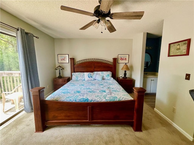 622 Brockinton Pt, Saint Simons Island, GA 31522 - bedroom with carpet flooring, access to exterior, a textured ceiling, a ceiling fan, and baseboards