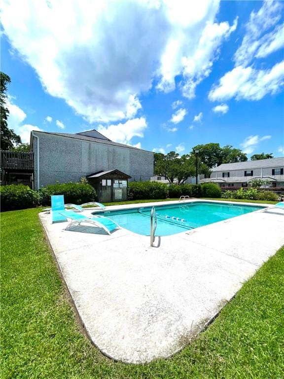 622 Brockinton Pt, Saint Simons Island, GA 31522 - community pool featuring a patio and a lawn