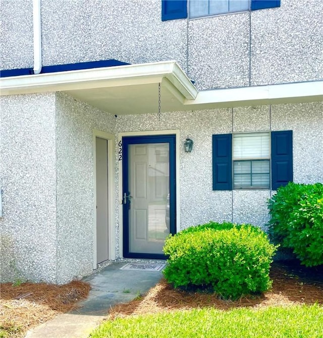 622 Brockinton Pt, Saint Simons Island, GA 31522 - doorway to property featuring stucco siding